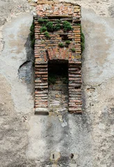 Medieval brick garderobe ruin on historic wall in Sighisoara, Transylvania, Romania. © krstrbrt