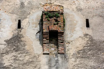 Medieval brick garderobe ruin on historic wall in Sighisoara, Transylvania, Romania. © krstrbrt