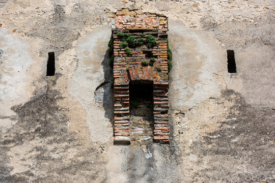 Medieval brick garderobe ruin on historic wall in Sighisoara, Transylvania, Romania.