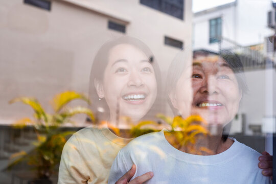 Joyful Asian mother and daughter bonding