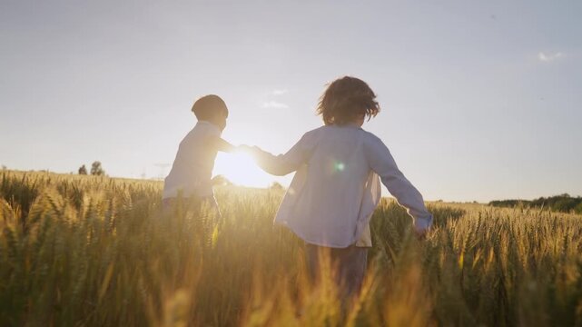 Brothers Kids Running Hand In Hand Across Open Field, Golden Hour. Best Friends