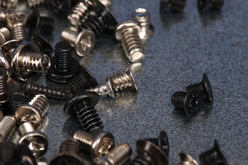 Fototapeta premium Metal screws for fastening equipment. Soft focus. Close-up. 