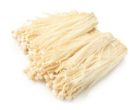 Clusters of raw enoki mushrooms isolated on white
