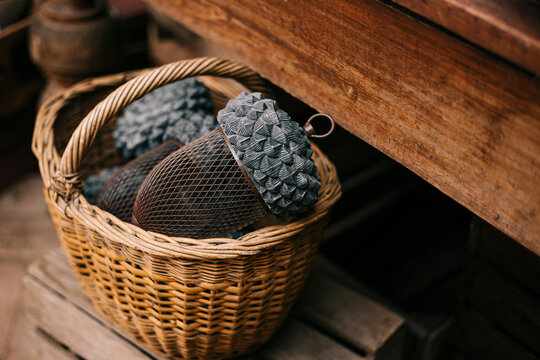 Rustic garden basket with pine cone and mesh ball decor