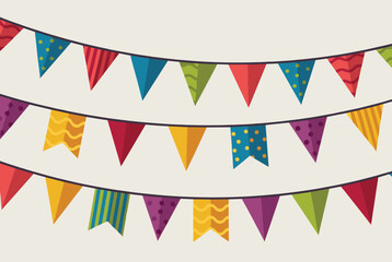 Obraz premium Colorful party bunting flags hanging in multiple rows on a light background for festive celebration decorations.