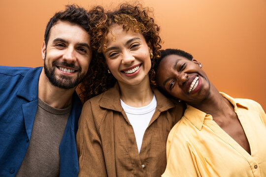 Happy diverse friends smiling in close portrait together