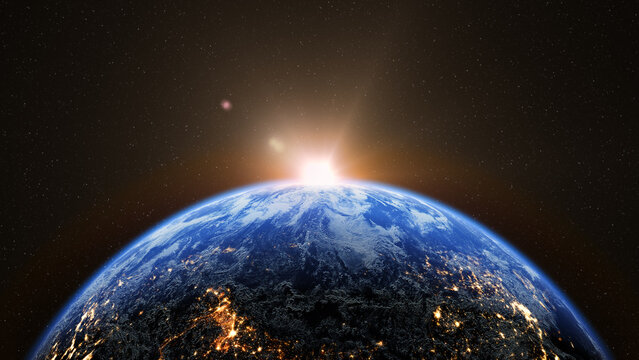 Sunrise over Earth from space with glowing city lights