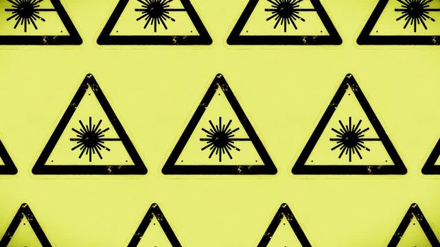 Abstract yellow laser warning sign pattern creates a seamless loop background.