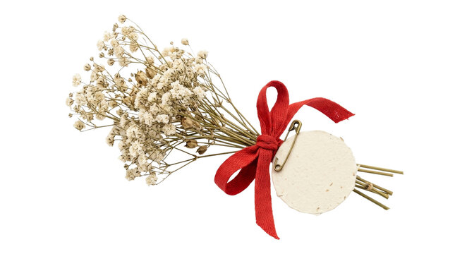 Dried flower bouquet with red ribbon and tag on black background