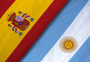 Close-up of Spain and Argentina flags side by side, symbolizing international relations, diplomacy, or football rivalry.