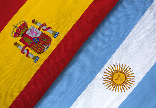 Close-up of Spain and Argentina flags side by side, symbolizing international relations, diplomacy, or football rivalry.