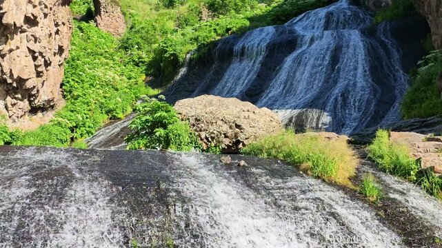 Water tumbles down rugged slopes