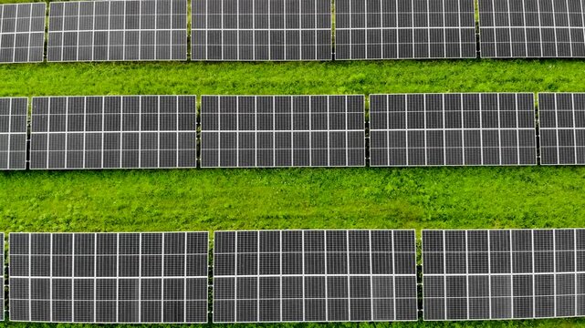 Aerial view of solar farm with photovoltaic panels and green energy production
