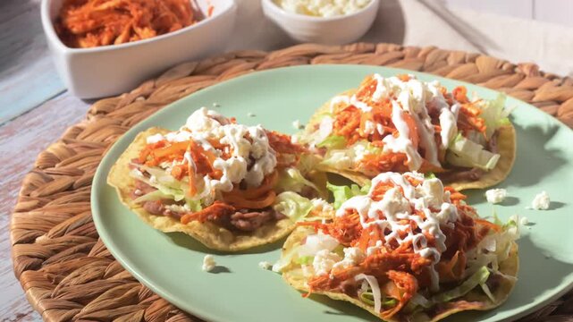 Mexican Food Styling Close-up with direct flash light. Mexican chicken tostadas with shredded chicken tinga and cotija cheese
