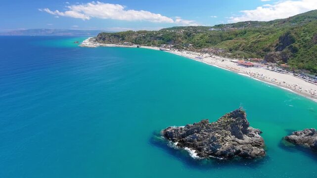 Ulivarella Beach and Ulivo Rock aerial view in slow motion, Calabria, Italy