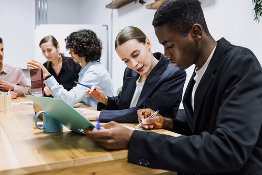diverse group of young business professionals or multicultural people working together in office