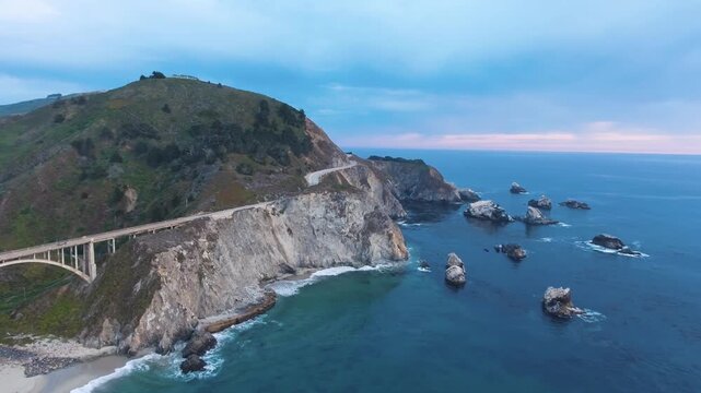 Aerial Bixby Bridge (Rocky Creek Bridge) and Pacific Coast Highway near Big Sur in California, USA America. Drone Shot