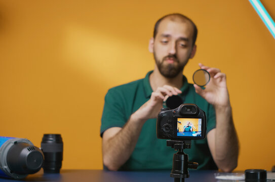 Professional photographer explains variable ND filter effects for a vlog, reviewing camera gear and image control for an online audience.
