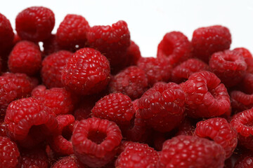 Ripe raspberries on a white background. Top view. Flat lay. © Pixora ST 