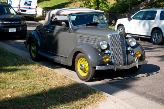 Vintage 1935 Ford Model 48 Deluxe Cabriolet automobile parked on the street. Identified by Google, recheck before using. St Paul Minnesota MN USA