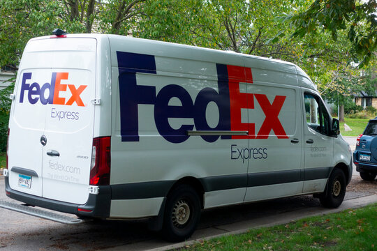 FedEx delivery truck delivering packages in the neighborhood. St Paul Minnesota MN USA
