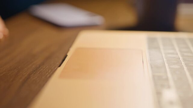 Close up woman finger using laptop trackpad. Touchpad scrolling work space