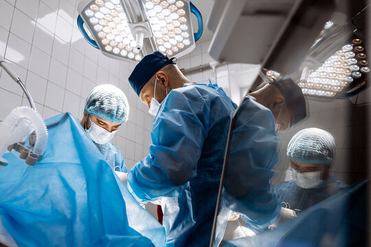 Surgeons working together during a hospital operation. Concept collaboration, surgical care, healthcare, patient safety, professionalism.