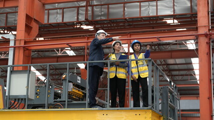 Fototapeta premium engineer team full skill quality for maintenance and training in industry factory worker , warehouse Workshop for factory operators, mechanical engineering team production.