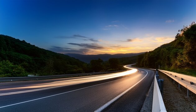 motion blur from cars driving on a winding scenic road at twilight