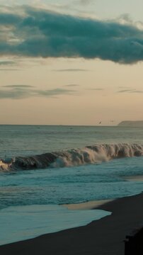 Slow Ocean Waves Crash on the Beach at Sunset sky clouds