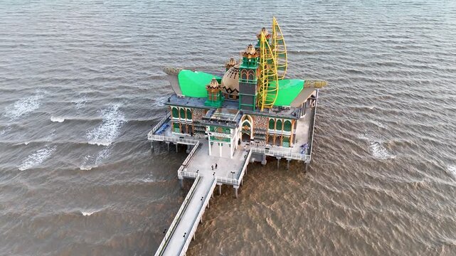 Drone view of the Ziyadatul Abrar Floating Mosque, located at Siring Pagatan Beach, South Kalimantan