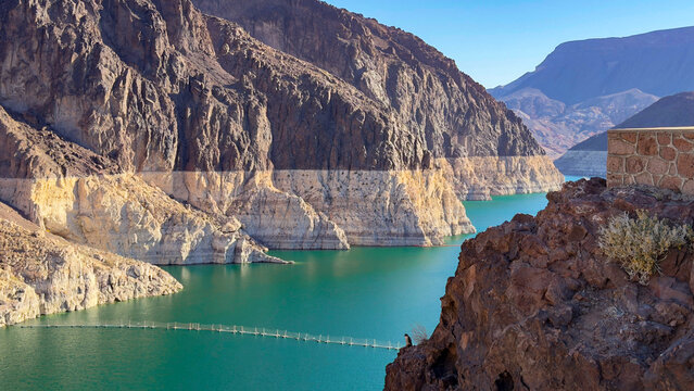 Elevated view of Lake Mead reservoir with turquoise water and prominent bathtub ring on the rugged canyon walls near Hoover Dam