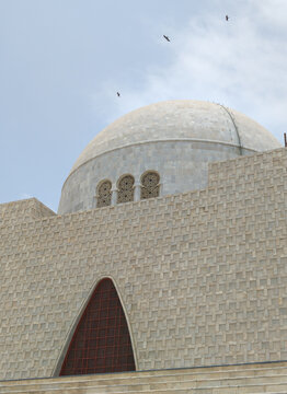 Mazar-e-Quaid Mausoleum of Muhammad Ali Jinnah in Karachi Pakistan Under Dramatic Cloudy Sky. Beautiful View of Mazar-e-Quaid National Monument in Pakistan.