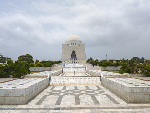 Mazar-e-Quaid Mausoleum of Muhammad Ali Jinnah in Karachi Pakistan Under Dramatic Cloudy Sky. Beautiful View of Mazar-e-Quaid National Monument in Pakistan.
