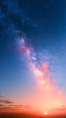 Fototapeta premium 夕焼けの地平線と夜空に広がる紫色の天の川