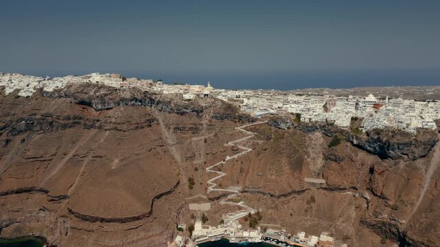 Aerial cliffside view of Fira/Thira, Santorini, Greece with switchback path