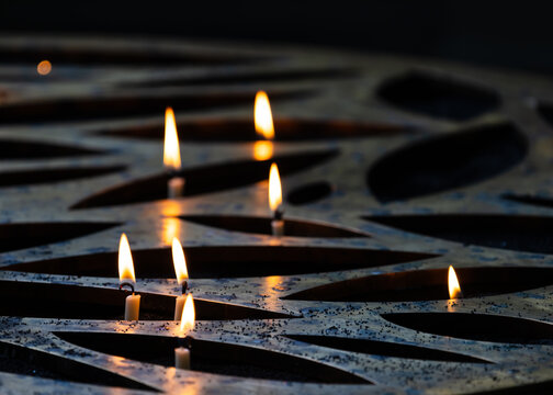 Candles burning in dark for peace and hope