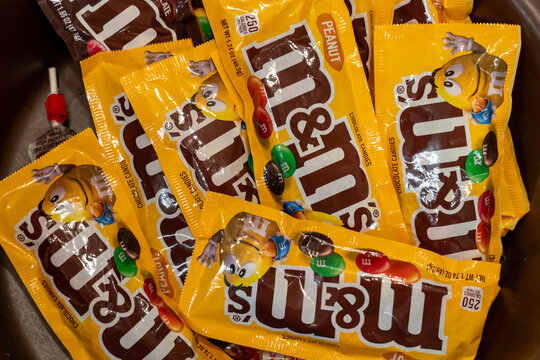 Fort Worth, Texas, USA - March 19, 2022: M and M&rsquo;s Peanut Chocolate Candy packs for sale in a bulk candy store. Fort Worth, Texas, USA. 