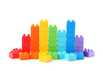 Naklejka premium Colorful plastic building blocks arranged in a bar graph shape growth progress and data visualization on a white background