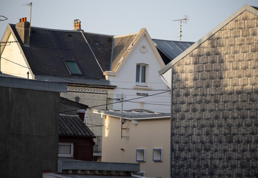 Traditional european rooftops with slate shingles and television antennas