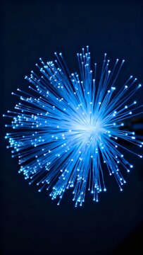 Blue fiber optic cables radiating light in a starburst pattern against dark background