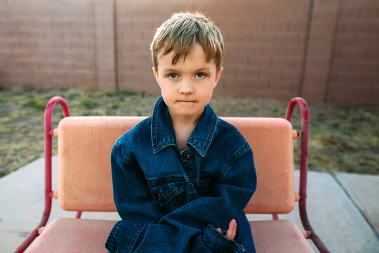 Portrait of a boy sitting in a chair