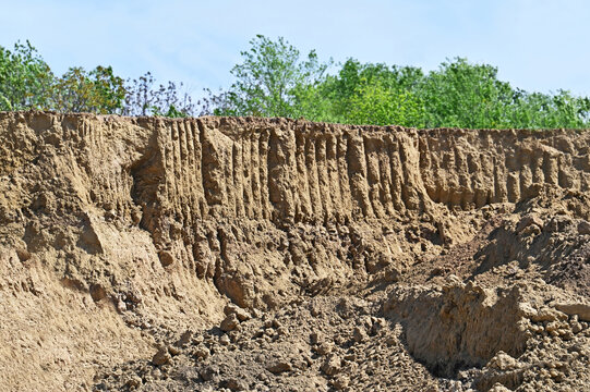 Pit of clay soil with traces of excavator work