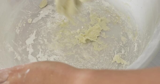 The culinary art of making traditional asian sweets. highlighting preserving cultural gastronomy through handcrafting dough to create the authentic thai bua loi dessert.