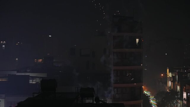 New Year Fireworks over City street at Midnight during Tet Lunar 