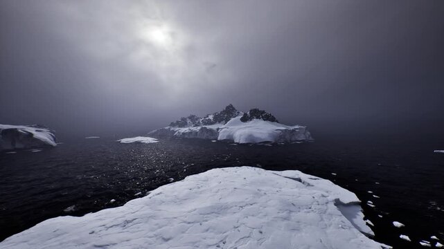 rugged icy foreground framing distant archipelago and low sun, survey perspective with sense of scale, creaming waves and cloudwashed light, expedition tone