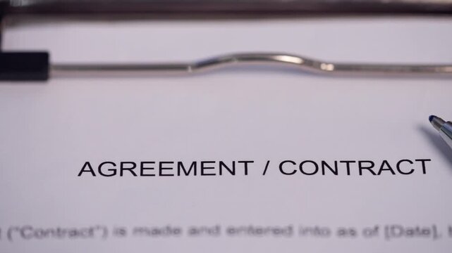 Business Contract Agreement Ready for Signature on Office Clipboard