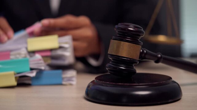 Judge's Gavel and Legal Case Files on Attorney Office Desk