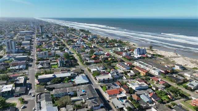 Arroio do Sal coastal neighborhood with beach shoreline, truck left through urban streets