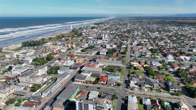 Arroio do Sal coastal city street with beach and ocean, pan left to right